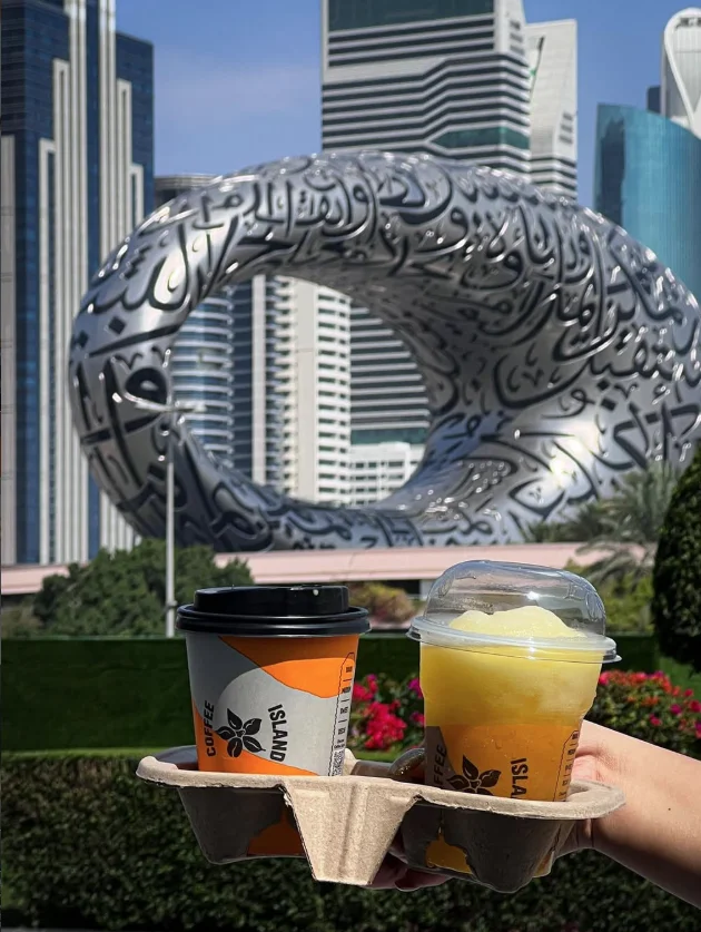 Coffee Island cups in front of the Museum of the Future, Dubai